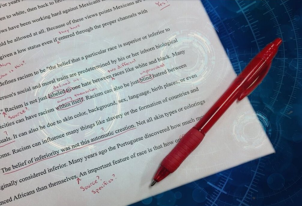 Editing Services design image showing an essay marked with red ink.